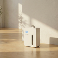 White aroma diffuser on a wooden floor with a light background