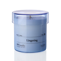 Blue candle in a transparent container labeled 'Lingering' by B&Candle on a white background